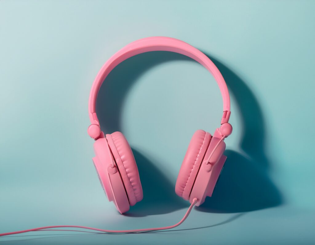 Pink headphones on a blue background